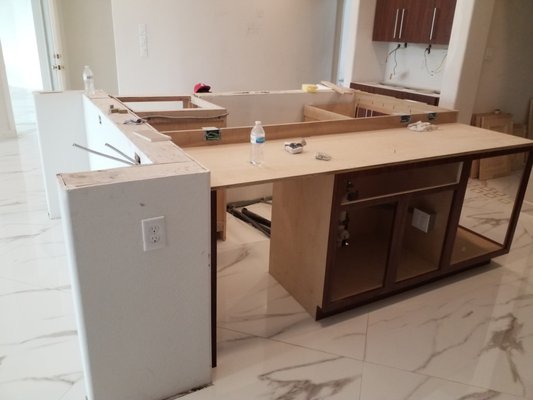 KITCHEN EXTENDED ISLAND AND COUNTER TOPS - EXTENDED ISLAND USING OLD STRUCTURE AND NEW CABINETS.  INSTALLED TAJ MAHAL 3CM QUARTZITE ISLAND AND COUNTER TOPS.