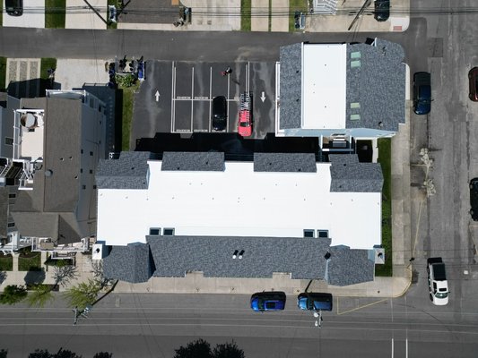 Tapered TPO roof - We rebuilt both flat roofs, fixed all the drainage, pipeboots, replaced 8 skylights and installed Slatestone Gray shingles. The job is in Ocean City, NJ.