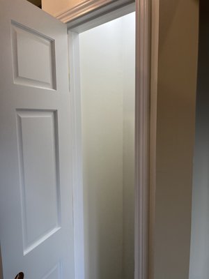 Laundry Room Cabinets - These cabinets were primed and painted to the customers specified color. The paint that was applied was traffic, moisture, and heat resistant due to the proximity to the washer and dryer located in a very small area. Door and trim details were coated with Benjamin Moore "Scuff-X" for durability and high traffic in and out of the laundry room. 
  After painting was complete, a decorative finish was added above the door to the garage.