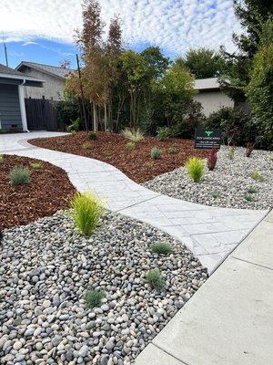 Moffitt - This specific landscape was designed by our friend Tina Johnson, of who has over 3 decades of plant experience. This particular project will provide layers of shrub privacy in the future. The homeowners will be able to sit in their patio, read a book, listen to music and much more all from the convenience of their private FRONT yard!