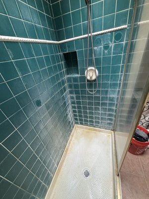 Shower Restoration - This shower had worn, cracked, and stained grout that was letting in moisture and ruining the look of the tile. We carefully removed the damaged grout and applied fresh, clean grout to every joint — restoring both the appearance and integrity of the shower. The clean lines and sealed finish now give it a refreshed, watertight look built to last. Shower Restoration - This shower had worn, cracked, and stained grout that was letting in moisture and ruining the look of the tile. We carefully removed the damaged grout and applied fresh, clean grout to every joint — restoring both the appearance and integrity of the shower. The clean lines and sealed finish now give it a refreshed, watertight look built to last.