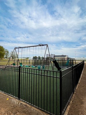 Lakeville Farm Install - This project in Lakeville started with just a patch of dirt, 50’ x 80’
We started by clearing out the land and grading it. We excavated two holes for install of in ground trampolines, put together and installed two metal framed playsets, added weed barrier and pea gravel to the entrance, installed an aluminum fence with concrete curb, and finished this project off with poured rubber safety surfacing. Lakeville Farm Install - This project in Lakeville started with just a patch of dirt, 50’ x 80’
We started by clearing out the land and grading it. We excavated two holes for install of in ground trampolines, put together and installed two metal framed playsets, added weed barrier and pea gravel to the entrance, installed an aluminum fence with concrete curb, and finished this project off with poured rubber safety surfacing.