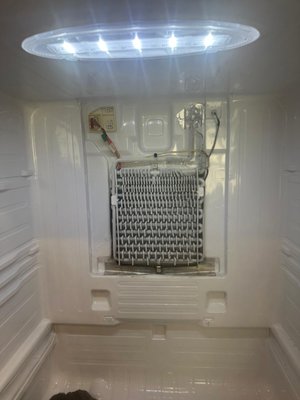 Samsung Refrigerator - Evaporator Fan Motor Replacement & Drain Line Defrost - This Samsung refrigerator was having cooling problems caused by a combination of issues in the freezer compartment. Our team found a failed evaporator fan motor along with a clogged, iced-over drain line that was preventing proper defrost drainage. We replaced the fan motor, cleared and opened the drain hose, and melted down the ice buildup around the coils to restore normal airflow and drainage. After reassembling and testing, the refrigerator was cooling properly with the evaporator coils clear and the drain flowing freely. Samsung Refrigerator - Evaporator Fan Motor Replacement & Drain Line Defrost - This Samsung refrigerator was having cooling problems caused by a combination of issues in the freezer compartment. Our team found a failed evaporator fan motor along with a clogged, iced-over drain line that was preventing proper defrost drainage. We replaced the fan motor, cleared and opened the drain hose, and melted down the ice buildup around the coils to restore normal airflow and drainage. After reassembling and testing, the refrigerator was cooling properly with the evaporator coils clear and the drain flowing freely.