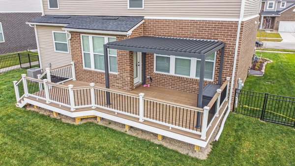 Check out this stunning outdoor transformation we recently completed in Canton! 🎉 - This deck features Trex Havana Gold decking boards paired with white fascia, white railings, and black balusters for a timeless look that perfectly complements the home.

To take it to the next level, we added a sleek, louvered pergola that offers both style and functionality—perfect for creating shade and enjoying the outdoors in any weather.

Ready to create your dream outdoor space? Let’s make it happen! 🏡✨