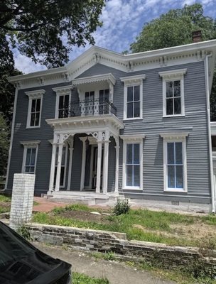 Historic Home Renovation - This remodel was done on a historic home built in 1926. It was important to the home owner that we keep as much of the original elements throughout the home as possible. This complete transformation was done while reclaiming the existing doors, corbels, and other architectural salvage elements. This project included plumbing and electrical work, installing new kitchen cabinets, vanities, a claw tub, and exterior work.