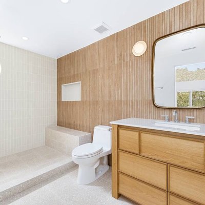 bathroom-kahala - This is a full bathroom renovation inspired by minimalist-Japanese-design, blending natural elements with a clean, open aesthetic. The walk-in shower features a built-in bench, offering both comfort and functionality, while its seamless design enhances the sense of space. A bamboo wall covering brings warmth and texture, complementing the serene atmosphere. The custom-made oak wood vanity adds a handcrafted touch. Soft, ambient lighting and a neutral-toned palette complete the look, creating a tranquil, spa that embodies simplicity. bathroom-kahala - This is a full bathroom renovation inspired by minimalist-Japanese-design, blending natural elements with a clean, open aesthetic. The walk-in shower features a built-in bench, offering both comfort and functionality, while its seamless design enhances the sense of space. A bamboo wall covering brings warmth and texture, complementing the serene atmosphere. The custom-made oak wood vanity adds a handcrafted touch. Soft, ambient lighting and a neutral-toned palette complete the look, creating a tranquil, spa that embodies simplicity.