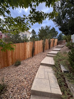 Castle Rock - This beautiful cedar fence with a unique design. Exposed posts on one side with support posts on other side. Posts were set 5' on center.