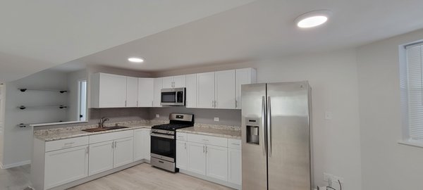 2 Unit Building Remodel - This two-unit remodel consisted of gutting out all of the flooring, kitchens, bathrooms, doors, some windows, and some drywall. Both units got brand new luxury vinyl plank flooring as well as new doors and 5 new windows. New kitchen cabinets, laminate countertop, and subway tile backsplash were installed to make a modern style kitchen. Both bathrooms got 12x24 porcelain tile on the floor and the wall as well as a new vanity and a toilet. Both floors were patched/sanded and painted. 2 Unit Building Remodel - This two-unit remodel consisted of gutting out all of the flooring, kitchens, bathrooms, doors, some windows, and some drywall. Both units got brand new luxury vinyl plank flooring as well as new doors and 5 new windows. New kitchen cabinets, laminate countertop, and subway tile backsplash were installed to make a modern style kitchen. Both bathrooms got 12x24 porcelain tile on the floor and the wall as well as a new vanity and a toilet. Both floors were patched/sanded and painted.