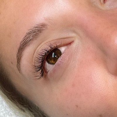 Classic lash extensions - This client has had lash extensions before and knew exactly what she wanted. She requested classic lashes for a more natural look and asked that I don’t lash the inner and outer corners to avoid droopy eyes. After the appointment was finished, she loved how her lashes looked and made her feel.