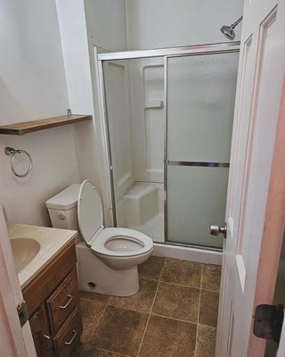 Bathroom renovation - This bathroom was renovated, with some gold accessories, a new walk in shower, niche, new flooring, new ceiling, new vanity and paint! As well as a new shower body and relocated the plumbing as well.