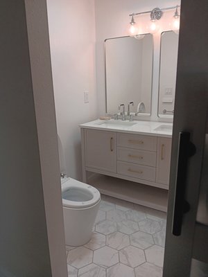 Salem Oregon bathroom remodel - Salem oregon bathroom remodel by ORIWS. All work was performed or managed by ORIWS. Complete demo of a closet to make the shower larger. Added Hardie backer. Installed tile walls, floor, and alcove. Waterproofed all tile work. Installed new water mixing valve and shower fixture. Installed new fan. Installed new electric heated toilet. Installed new sockets and one additional outlet. Installed a barn door. Drywall finished and painted. Salem Oregon bathroom remodel - Salem oregon bathroom remodel by ORIWS. All work was performed or managed by ORIWS. Complete demo of a closet to make the shower larger. Added Hardie backer. Installed tile walls, floor, and alcove. Waterproofed all tile work. Installed new water mixing valve and shower fixture. Installed new fan. Installed new electric heated toilet. Installed new sockets and one additional outlet. Installed a barn door. Drywall finished and painted.