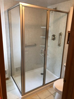 Shower Transformation - An old neoangle tiled shower turned into a spacious 36x60 glass enclosed space with plenty of shelving. Shower Transformation - An old neoangle tiled shower turned into a spacious 36x60 glass enclosed space with plenty of shelving.