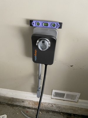 Ev Charger Installation - We help this new Tesla owner by installing a vehicle charger with an easy reach to his car.