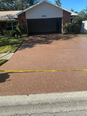 Garage, Driveway, and Walkways Floors - Complete upgrade of the garage, walkways, and driveway with polyaspartic floor coatings. This two-day project features the color "Chestnut" and comes with a lifetime warranty.