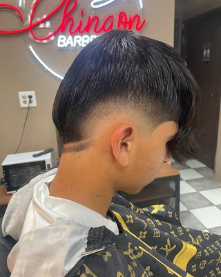 Burst Taper W/ Design - Our experienced barbers specialize in creating the perfect blend of sleek and sharp, delivering a look that’s both modern and timeless. The Burst Taper offers a clean, gradual fade that adds definition - This can be paired with a design for a unique look. Come in today and let us give you the fresh cut you deserve. Burst Taper W/ Design - Our experienced barbers specialize in creating the perfect blend of sleek and sharp, delivering a look that’s both modern and timeless. The Burst Taper offers a clean, gradual fade that adds definition - This can be paired with a design for a unique look. Come in today and let us give you the fresh cut you deserve.