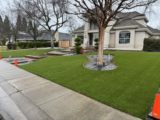 Front Yard Transformation - This yard was originally bare dirt with uneven grading and no usable lawn space. We performed full excavation, compaction, and drainage preparation before installing high-quality artificial turf. The finished result is a seamless, pet-friendly lawn that enhances the entire property and stays green all year.