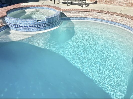 GRANADA WHITE PLASTER - The old plaster and tile was removed in this pool and white plaster and tile was installed.