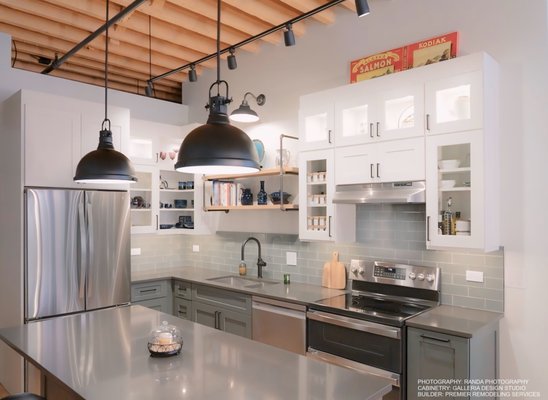 Timeless Charm, Modern Heart Kitchen - We recently assisted in a stunning transformation of a kitchen in a historic Chicago building, turning a once tight and dysfunctional space into the heart of the home. Our design beautifully blended modern functionality with the building’s rich history. The cabinetry played a key role, featuring a striking combination of trending pewter green lower cabinets and classic white shaker uppers. To open up the space and maintain an airy feel, we incorporated open wall cabinets, adding both charm and practicality. The cabinetry’s clean lines and timeless color choices seamlessly updated the kitchen while preserving the historic essence of the home, making it both a showpiece and a warm gathering place.