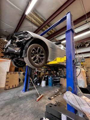 2020 Dodge Charger R/T - This Dodge Charger was hit from behind and pushed into an object in the front. Luckily there were no injuries. The rear end repairs included rear body panel replacement, floor pan pull and repair, repair and refinish LT and RT quarter panels for buckles, rear frame rail measuring and straightening, full rear bumper assembly replacement, aftermarket decklid spoiler replacement, exhaust and muffler replacement, and decklid alignment. Front end repairs included full front bumper assembly replacement, LT and RT fender repair and refinish for buckles, A/C condensor replacement and EVAC recharge (R1234yf), and headlamp replacement. Aftermarket splitter, rear diffuser, and rear spoiler replacement in-house. Blind Spot Monitoring System recalibrated once vehicle was reassembled. 2020 Dodge Charger R/T - This Dodge Charger was hit from behind and pushed into an object in the front. Luckily there were no injuries. The rear end repairs included rear body panel replacement, floor pan pull and repair, repair and refinish LT and RT quarter panels for buckles, rear frame rail measuring and straightening, full rear bumper assembly replacement, aftermarket decklid spoiler replacement, exhaust and muffler replacement, and decklid alignment. Front end repairs included full front bumper assembly replacement, LT and RT fender repair and refinish for buckles, A/C condensor replacement and EVAC recharge (R1234yf), and headlamp replacement. Aftermarket splitter, rear diffuser, and rear spoiler replacement in-house. Blind Spot Monitoring System recalibrated once vehicle was reassembled.