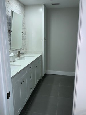 Boca Raton Master Bathroom Bathroom Remodel - This family wanted a bathroomto remodel for the kids. The tiles were designed so the kids could touch 3-D colorful tiles. The vanity is a simple white shaker door. Boca Raton Master Bathroom Bathroom Remodel - This family wanted a bathroomto remodel for the kids. The tiles were designed so the kids could touch 3-D colorful tiles. The vanity is a simple white shaker door.