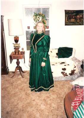 Christmas Gown with matching shawl and hand muff - I made this for me for a Christmas event in Scottsville VA. It took me about 2 weeks of sewing long days and nights plus running a Belgian draft horse farm. It is made from Emerald green velvet fabric, {yes real velvet!} with Juliet sleeves and a fitted bodice. Gold braid trim on the sleeves, bodice and hem around the bottom. I lined inside with sateen cloth throughout to help make it soft against my skin and for extra warmth. VA gets cold in December. I also made a shawl with the same material and lined with sateen with faux fur trim, as well as, a faux fur old fashioned hand muff.  Beautiful dont you think?