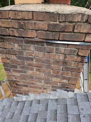 Brick chimney repair - Chimney had cracks in the cement crown and gaps and spacing between the bricks we installed a new cement crown and chimney cap and also did tuck pointing on the bricks Brick chimney repair - Chimney had cracks in the cement crown and gaps and spacing between the bricks we installed a new cement crown and chimney cap and also did tuck pointing on the bricks