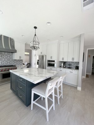 Kitchen Remodeling  Mission Viejo - This Mission Viejo kitchen needed a full refresh. The rest of the home had been updated but the kitchen hadn't kept up. ALLOC Kitchen & Bath gutted it and rebuilt it with custom two-tone cabinetry, a marble waterfall island, mosaic tile backsplash, and professional-grade appliances — turning an outdated space into a high-end showpiece.