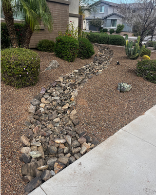 Yard Refresh in Phoenix - This one was about color. Red and yellow hibiscus, lantana, ice plant, and star jasmine vines climbing in — all set against fresh cinnamon brown granite out front and Apache Brown in back. We pulled 760 square feet of thirsty turf for synthetic grass, and built a low stuccoed block wall to tuck the pool equipment out of sight. Same yard, completely different feeling. Yard Refresh in Phoenix - This one was about color. Red and yellow hibiscus, lantana, ice plant, and star jasmine vines climbing in — all set against fresh cinnamon brown granite out front and Apache Brown in back. We pulled 760 square feet of thirsty turf for synthetic grass, and built a low stuccoed block wall to tuck the pool equipment out of sight. Same yard, completely different feeling.