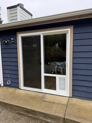 sliding door featuring a built-in dog door - Replaced old sliding door with new sliding door featuring a built-in dog door. sliding door featuring a built-in dog door - Replaced old sliding door with new sliding door featuring a built-in dog door.