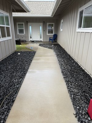Power Washing Concrete Patios 2025 - We power-washed the driveway, sidewalk, patio, and doorstep of this lovely Maui home. After removing grime from cars and trees, the concrete surfaces looked as clean as the day they were laid. Our precision pressure washer cleaned the concrete without disturbing the landscaping surrounding it. Power Washing Concrete Patios 2025 - We power-washed the driveway, sidewalk, patio, and doorstep of this lovely Maui home. After removing grime from cars and trees, the concrete surfaces looked as clean as the day they were laid. Our precision pressure washer cleaned the concrete without disturbing the landscaping surrounding it.