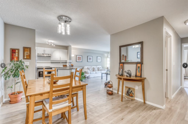 SOLD - Immaculate very well looked after Condo - First time on the market in the Newport Point complex. This north facing beautiful and elegant top floor (4th floor) end unit feels like home. Bright, airy and immaculate, you will for sure fall in love with this condo as soon as you step in! It is painted in warm, neutral taupe Recently upgraded, with gleaming LVP flooring, modern LED light fixtures, chrome door hardware, stainless-steel appliances, and quartz countertop in kitchen and bathroom. Open living space is great for entertaining family and friends seamlessly between the living room, open kitchen and dining area. Enjoy cooking in a kitchen that boasts plenty of space, giving it a bright and clean look. Relax in your spacious living room or enjoy the clean air from your oversized balcony overlooking beautifully landscaped grounds with views of the lake sparkling in the sunshine and sunsets that are just gorgeous! Separate coat closet and a laundry/storage room provide ample storage space. The primary retreat has a large walk-in closet and a 4-piece ensuite. A spacious second bedroom with a generous closet can also be used as a study room or home office. Enjoy this safe, secure development with an easy living lifestyle. One titled underground heated parking stall #12 in this secure building. Steps to walking trails around the serene lake & adjoining shopping, Vivo Centre, restaurants, transit, the coming Ring Road & more! ~ Condo fees include ELECTRICITY, GAS, WATER/SEWER, HEAT & HOA FEES FOR LAKE ACCESS ~ A stone's throw away from YYC Airport! Great for anyone seeking an exciting, convenient & worry-free living. Love where you live … Come and visit this beautiful, ready to move-in home. Pets allowed with board approval.