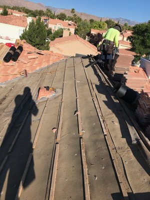 Raise all tile on left slope repair - Raise all tile on left slope where pool solar was. Reroof with new 30 pound underlayment new 1x2 wood battens. Reset tile on top of new underlayment.