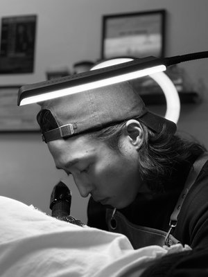Ivan's Tattoo - Ivan
Black & Gray/Blackwork

Ivan is a tattoo artist with a deep passion for black and grey work. His style focuses on the subtle interplay of contrast, shading, and tone — using only black, grey, and white to create depth, texture, and striking visual impact. Whether you’re looking for a custom piece or drawn to classic black & grey designs, Ivan brings a unique artistic vision to every tattoo.

He welcomes custom designs and enjoys collaborating with clients to turn personal ideas into timeless tattoos. From bold contrast to soft gradients, Ivan’s work highlights the beauty of monochrome storytelling.