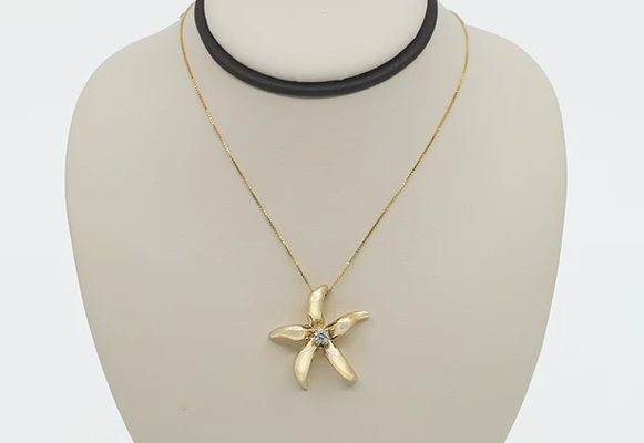 Solid 14K Gold Starfish With Diamond - This gorgeous Starfish pendant is one of our best-sellers because of it’s balance of wearability and elegance. This piece is a standout, and is available in both white gold and yellow gold. Both finishes are accented by a sparkling diamond center. Solid 14K Gold Starfish With Diamond - This gorgeous Starfish pendant is one of our best-sellers because of it’s balance of wearability and elegance. This piece is a standout, and is available in both white gold and yellow gold. Both finishes are accented by a sparkling diamond center.