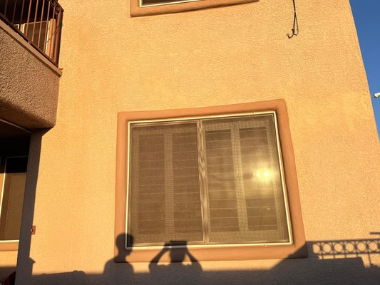Stucco and Window pop out repair - Our client had a solar panel that fell and hit the window and the exterior wall causing damage in the window pop out and dents on the wall, we repaired all the damaged areas, we provided materials and did color matching.