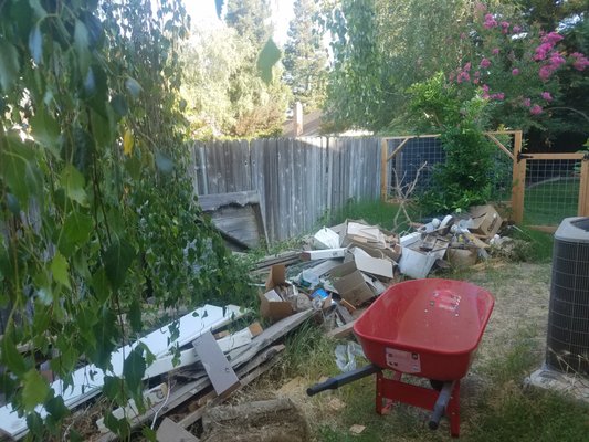 Property Cleanup - The customer recently moved into the house and the previous customer left behind a pile of junk in the yard. Property Cleanup - The customer recently moved into the house and the previous customer left behind a pile of junk in the yard.
