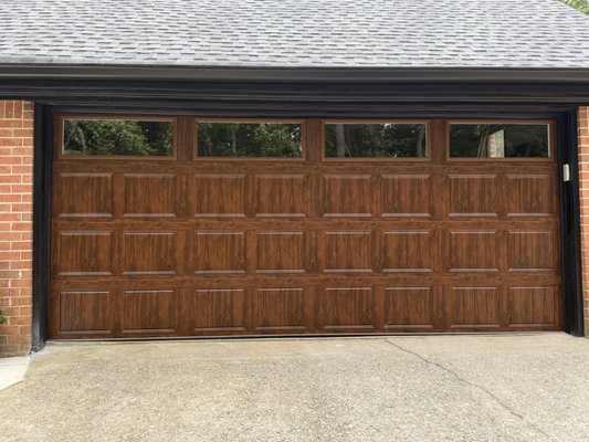 New Garage Doors - Add warmth and elegance to your home with a Walnut wood-grain garage door. With a high R-value of 12, it not only improves insulation but also elevates your home’s curb appeal and value.