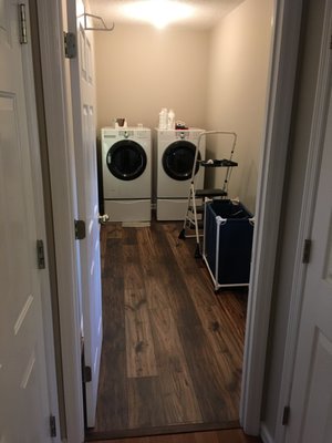 Laundry Room Renovation - Customer had us knock out the back wall of their small laundry room to include a space on the other side being used as junk room. The transformation doubled the length of the room.