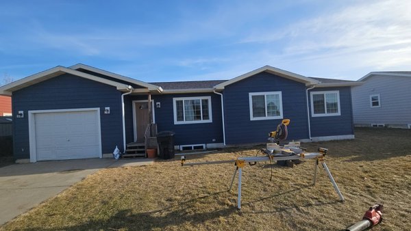 Rapids blue LP siding - This exterior remodel was done on a house that was hit by hail. Rapids blue LP siding - This exterior remodel was done on a house that was hit by hail.