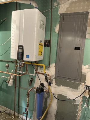 Tankless Water Heaters - A tankless water heater offers efficient, on demand hot water while reducing energy usage compared to traditional tank systems. By heating water only when it’s needed, the system provides a continuous supply without the limitations of a storage tank. This compact design saves space and integrates seamlessly into any home, delivering reliable and cost-effective hot water for daily use. Tankless Water Heaters - A tankless water heater offers efficient, on demand hot water while reducing energy usage compared to traditional tank systems. By heating water only when it’s needed, the system provides a continuous supply without the limitations of a storage tank. This compact design saves space and integrates seamlessly into any home, delivering reliable and cost-effective hot water for daily use.