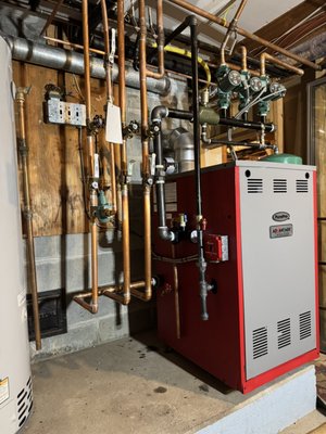 Boiler Installation - Executed a high-tolerance copper and black iron manifold layout with perfectly plumb vertical drops and square horizontal runs. Organized a multi-zone pumping station using a Taco header system, ensuring balanced flow and consistent heat distribution across all zones. Boiler Installation - Executed a high-tolerance copper and black iron manifold layout with perfectly plumb vertical drops and square horizontal runs. Organized a multi-zone pumping station using a Taco header system, ensuring balanced flow and consistent heat distribution across all zones.