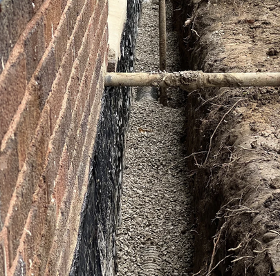Exterior Systems - Check the outside walls for any cracks that could let water, bugs, or dirt inside. Put in drains underground with gravel to move rainwater away from the basement. Fill the area with soil so it's level with the ground. Seal any cracks you find above ground, and make sure the pipes that carry rainwater are long enough. You might also need to open up some spots to look for cracks, seal them, and fill them back in. Exterior Systems - Check the outside walls for any cracks that could let water, bugs, or dirt inside. Put in drains underground with gravel to move rainwater away from the basement. Fill the area with soil so it's level with the ground. Seal any cracks you find above ground, and make sure the pipes that carry rainwater are long enough. You might also need to open up some spots to look for cracks, seal them, and fill them back in.