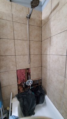 Tile repair in tub - This was a simple tile repair. The client had a plumber do some work on the valve and I came in to repair the tile.