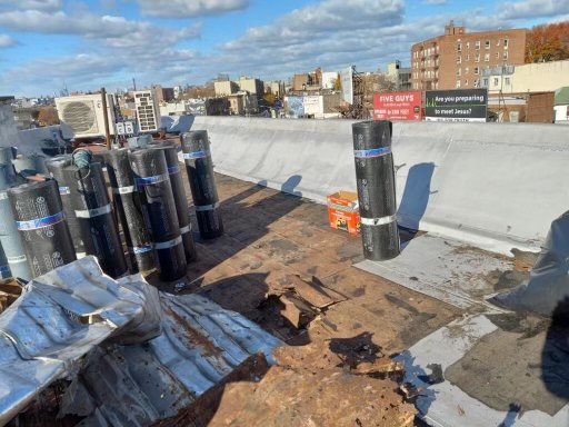 New flat roof system! - A client informed us that there roof was in really bad shape, we went out and inspected the roof finding multiple seams opened, pockets of water, some sections had opening wholes the client requested to remove all the roof system and inspected the integrity of the foundation of the roof doing so as per request by owner finding plywood saturated and beams damaged we replaced an entire new roof system! Our client was so pleased at our workman ship, high quality materials, our budget friendly prices, and our amazing warranty!! call today for your free roof estimate 718-795-6640