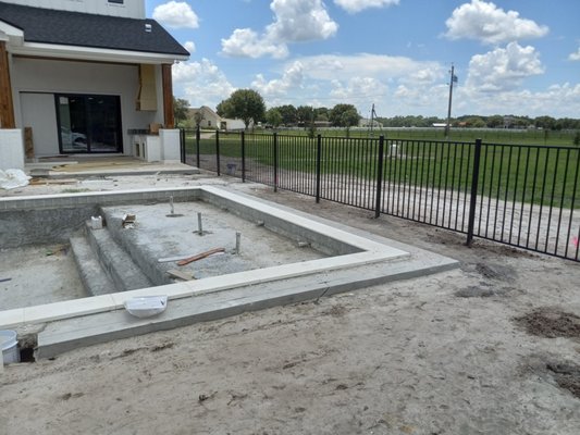 2-Rail Pool Code Black Aluminum - New home build with the 2-rail pool code black aluminum ready for landscape and pavers. 2-Rail Pool Code Black Aluminum - New home build with the 2-rail pool code black aluminum ready for landscape and pavers.