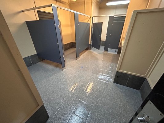 Bathrooms HOA Pool - Homeowner's assocation had an urgent need to address their floors and doors within their pool area.  They needed this done within a week and we were able to jump in and address their issues immediately.  We removed old paint that was peeling and laid down our base coat with flakes.  We also painted the doors to complete the look.
