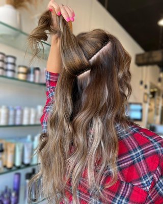 Invisible Bead Extensions - Invisible Bead Extensions® are different than any other hand-tied hair extension method on the market! I.B.E.® is the only seamless hand-tied method that creates no tension on the hair, has no exposed beads, and does not irritate the scalp in any way.
It gives you the ability to wear your hair up on day of install without any discomfort or damage to the hair.  They are undetectable whether your hair is up or down. When you have I.B.E.®, the maintenance is every 8-12 weeks. Your initial maintenance should be 8 weeks after install and from there, we will reassess whether you should go longer than 8 weeks from there on out or not. With I.B.E.®, the hair is reusable up to a year, sometimes longer with proper care and love. 
Only top quality hand-tied hair extensions lines are used on Invisible Bead Extensions® applications!