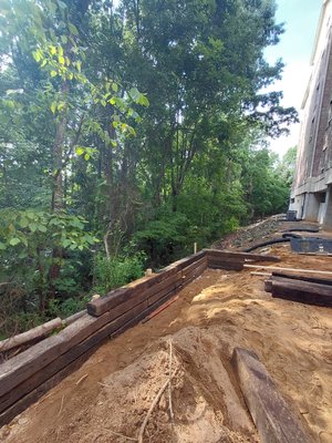 retaining  wall and gravel fill  to level - retaining wall and gravel fill to level.  We compact every 8 inches.  north carolina