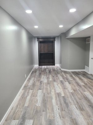 Finished basement remodel - Elevated finished basement, complete with LED back lighting and a tiled gas fireplace. Finished basement remodel - Elevated finished basement, complete with LED back lighting and a tiled gas fireplace.