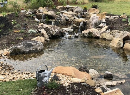 Natural Swimming Pool - Natural Swimming Pool with River Rock Beach Entry. Giant Waterfall with a Upper and Lower River Rock Bog for Optimal Filtration! This was actually built for the homeowner’s dogs, but I’m sure they’re not the only ones enjoying this beautiful Water Feature! Natural Swimming Pool - Natural Swimming Pool with River Rock Beach Entry. Giant Waterfall with a Upper and Lower River Rock Bog for Optimal Filtration! This was actually built for the homeowner’s dogs, but I’m sure they’re not the only ones enjoying this beautiful Water Feature!